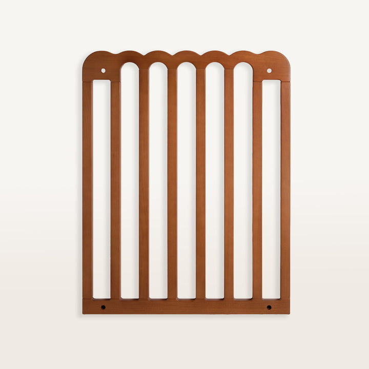 Walnut scalloped pet gate on a white background