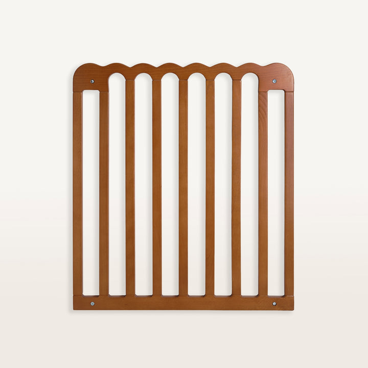 Walnut baby gate on white background.